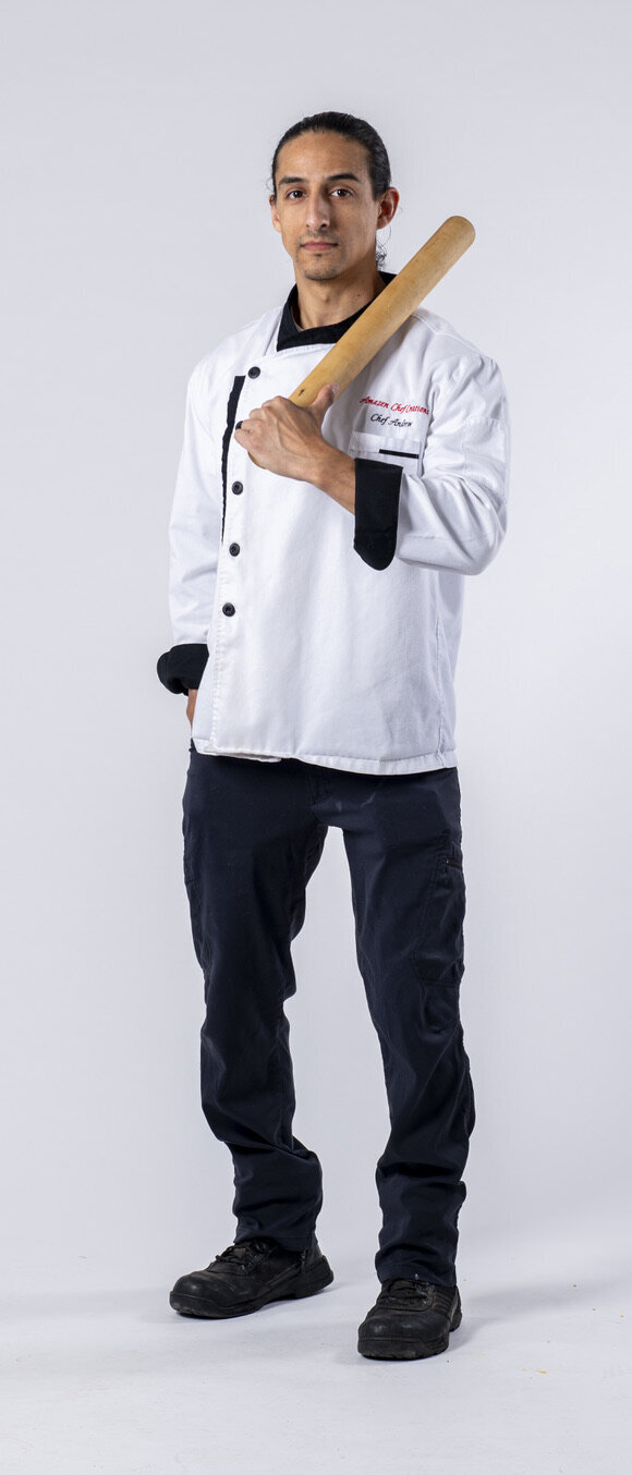 An Amazen chef holding a rolling pin